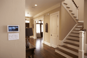 Thermostat on the wall in a two-story home