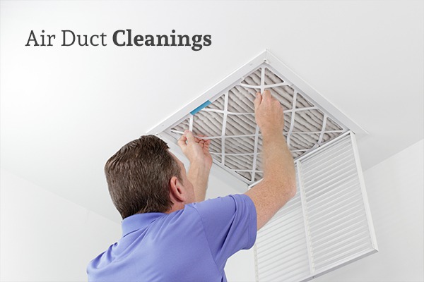 A man replacing an air duct filter beneath the words Air Duct Cleanings