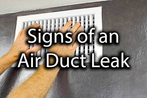 A person feeling for air in their air duct with the words, "signs of an air duct leak."